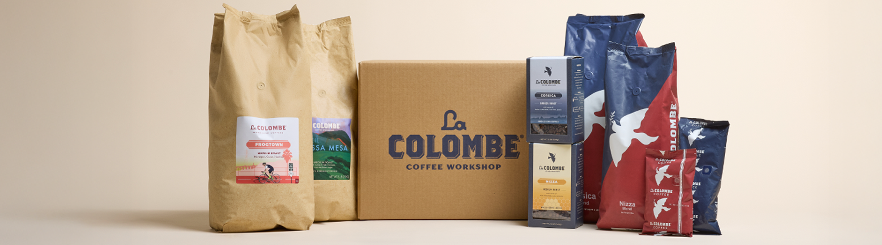 La Colombe coffee packaging including bags and a box on a beige background